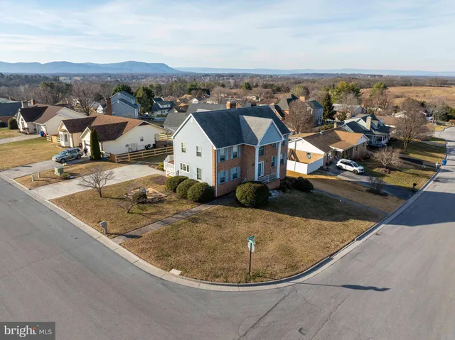 an aerial view of a residential houses with outdoor space