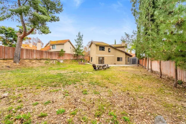 a house with swimming pool in front of it