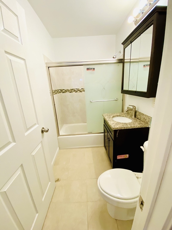 35 Cherry Street, Unit 1 Chelsea, MA 02150 - Photo 8 of 14 a bathroom with a sink toilet and shower