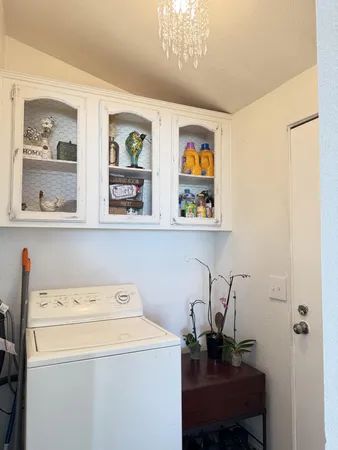a view of storage and utility room with racks on the wall