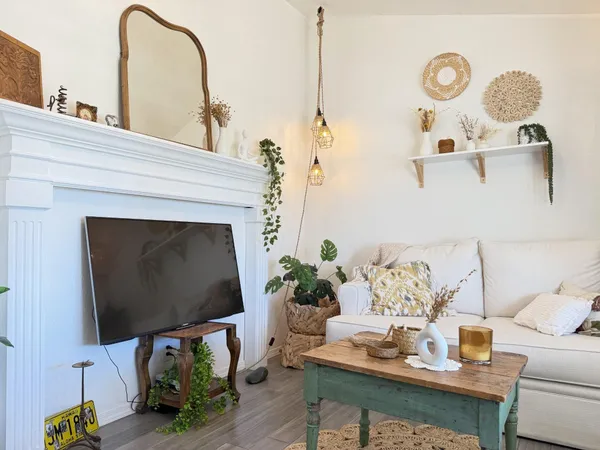 a living room with furniture and a fireplace