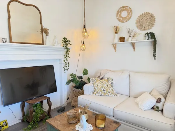 a living room with furniture and a fireplace