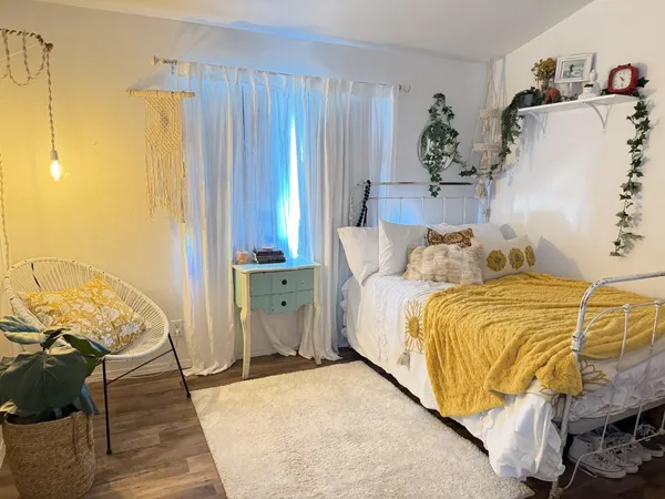 a bedroom with a bed and a dresser