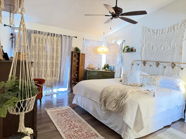a bed room with a bed and a book shelf