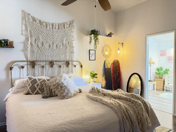 a bedroom with a bed and a dresser