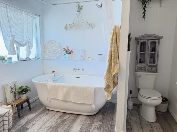 a bathroom with a sink mirror vanity and toilet