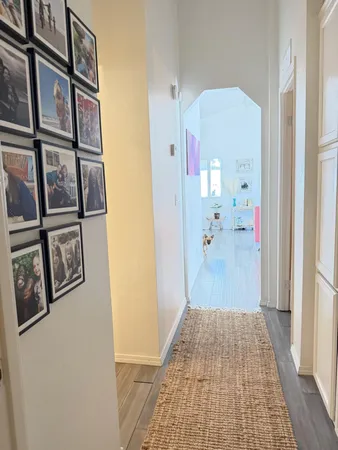 a bathroom with a shower curtain and a window