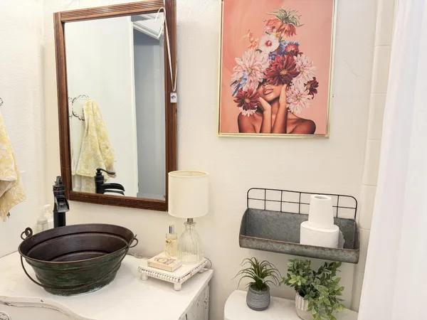 a living room with lots of furniture and a chandelier