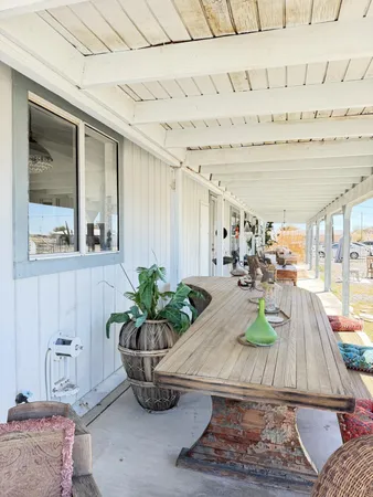 a outdoor living space with furniture and a fireplace