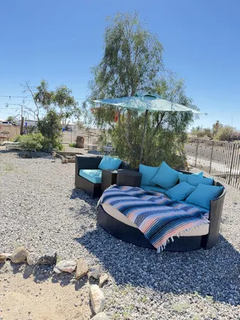 a view of a dinning table and chairs in patio