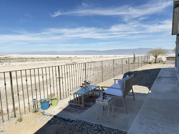 a view of a building with wooden fence
