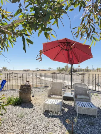 a view of a patio in the backyard