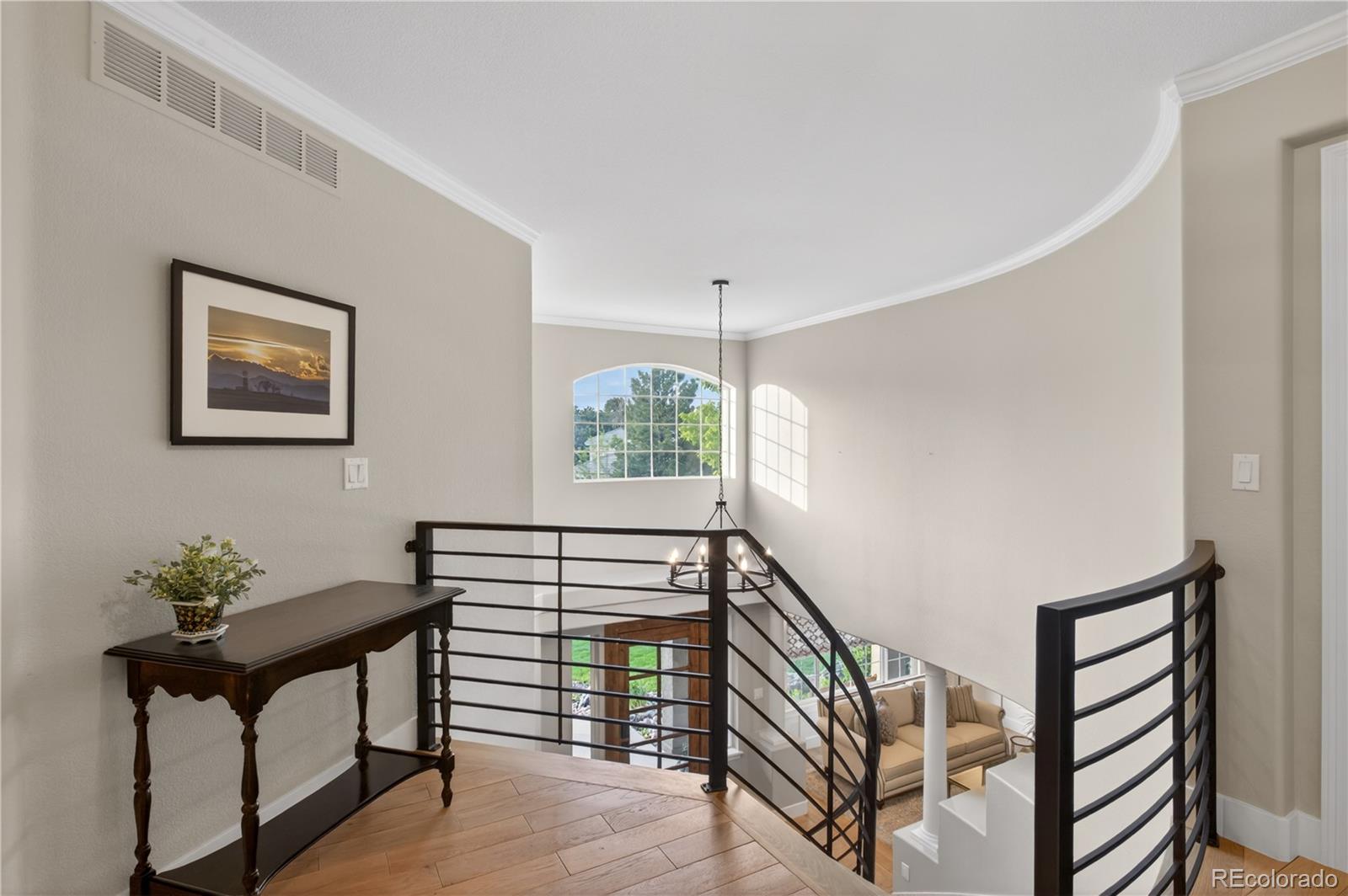 3041 Wyecliff Way Highlands Ranch, CO 80126 - Photo 24 of 50 a view of entryway and hall with wooden floor