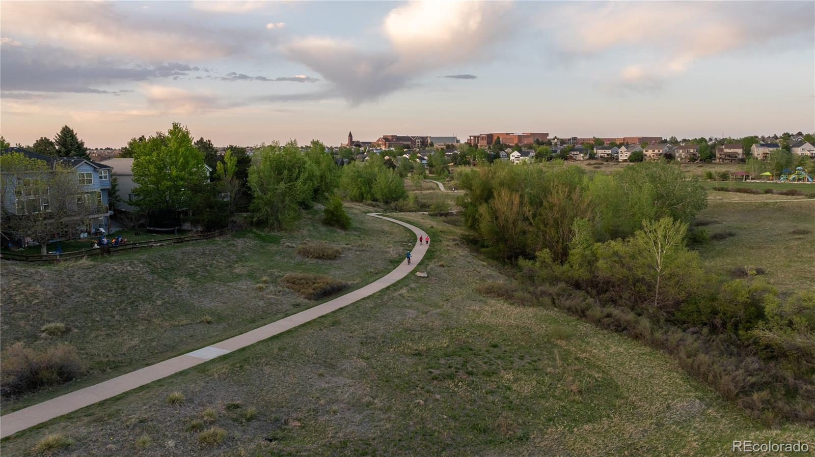 3041 Wyecliff Way Highlands Ranch, CO 80126 - Photo 48 of 50 a view of a green field with lots of trees in the background