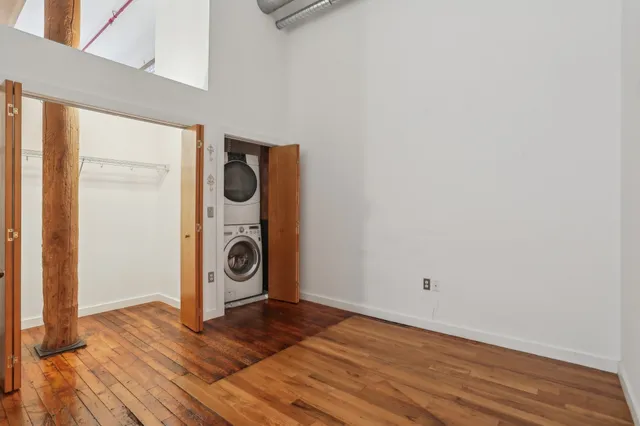a view of a utility room with wooden floor