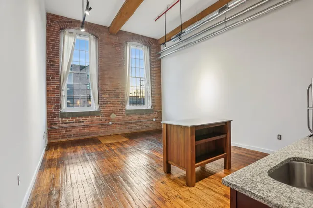 a view of kitchen and wooden floor
