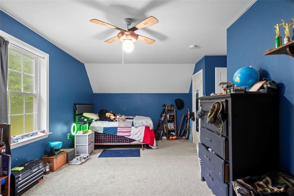 105 Jacobs Road Harrisville, PA 16038 - Photo 12 of 38 a children room with furniture and a flat screen tv