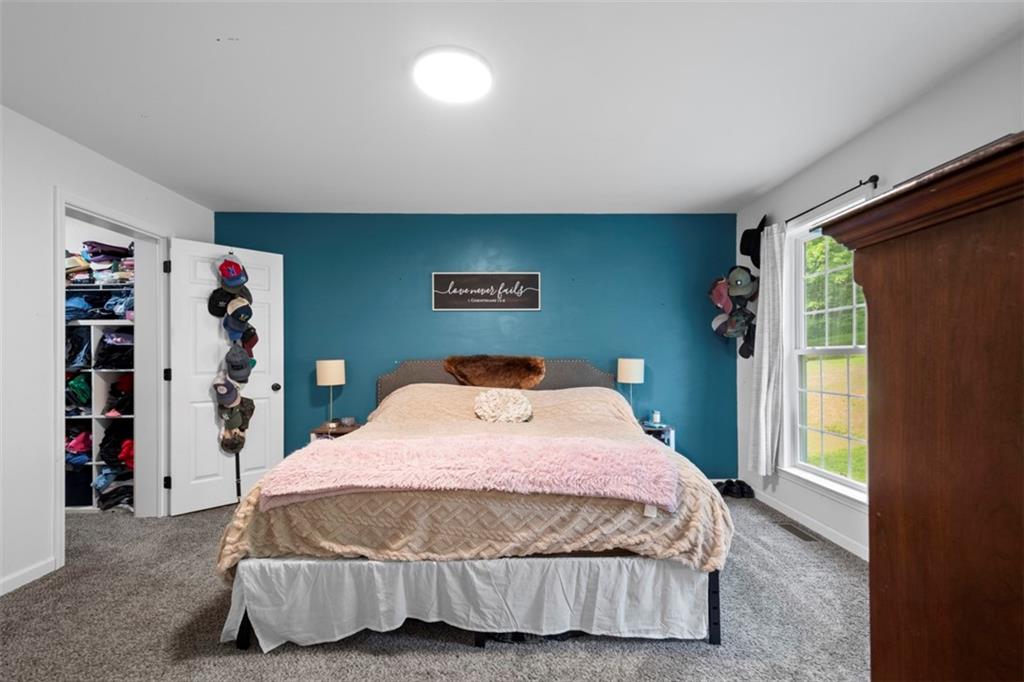 105 Jacobs Road Harrisville, PA 16038 - Photo 19 of 38 a bedroom with a bed and a window