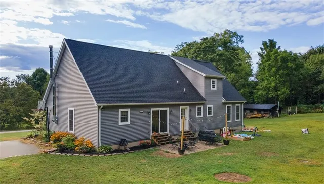 a view of a wooden deck with a yard