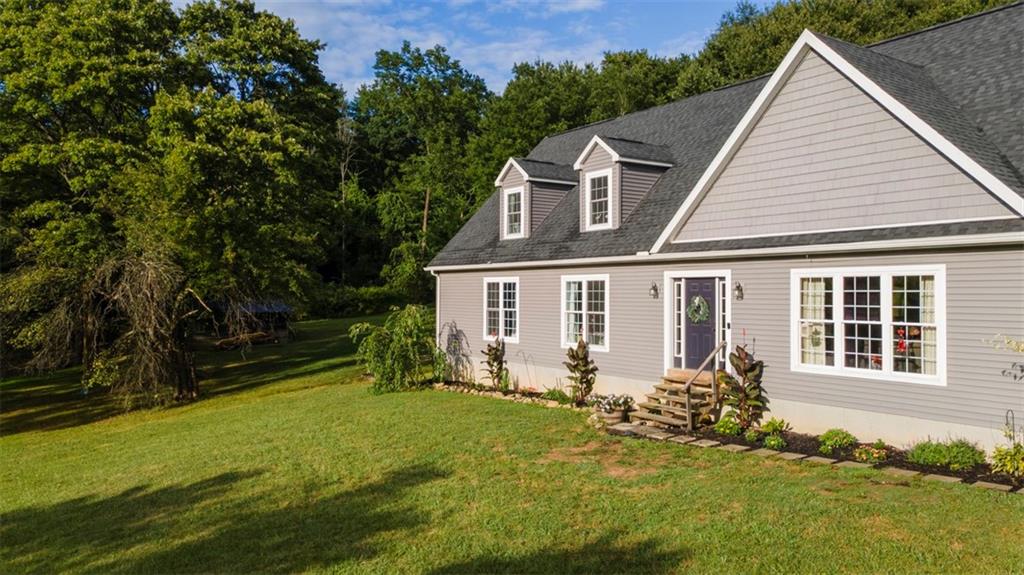 105 Jacobs Road Harrisville, PA 16038 - Photo 3 of 38 a view of a house with backyard and sitting area
