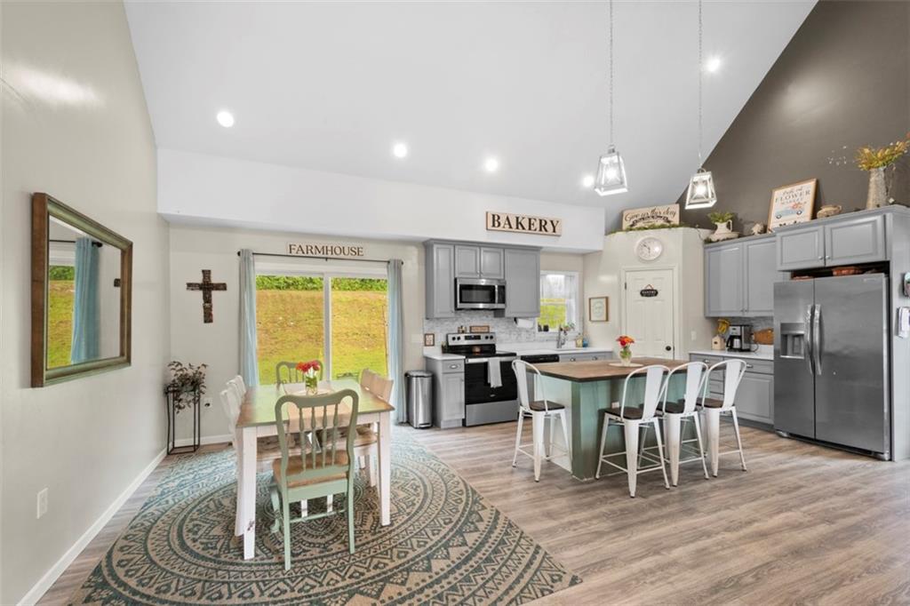 105 Jacobs Road Harrisville, PA 16038 - Photo 9 of 38 a view of a dining room with furniture window and wooden floor