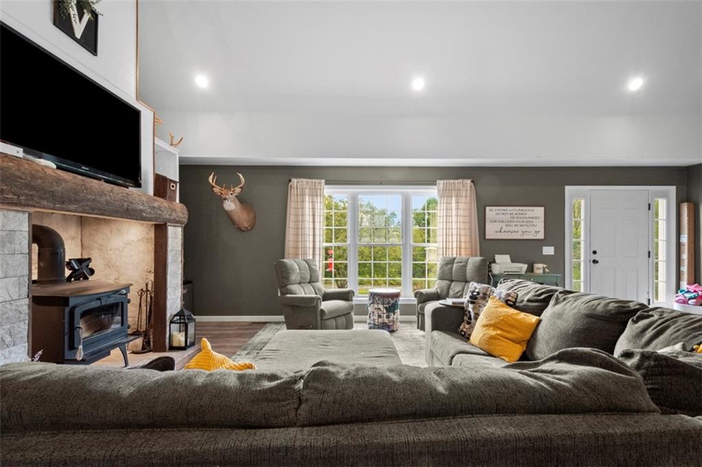 105 Jacobs Road Harrisville, PA 16038 - Photo 10 of 38 a living room with furniture and a flat screen tv