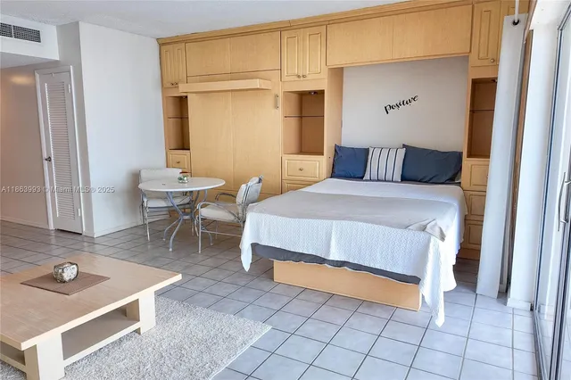 a bedroom with a bed and walk in closet