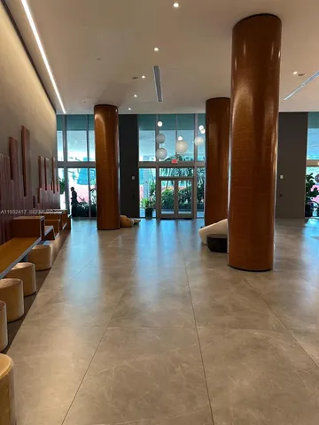 a view of a living room and chandelier