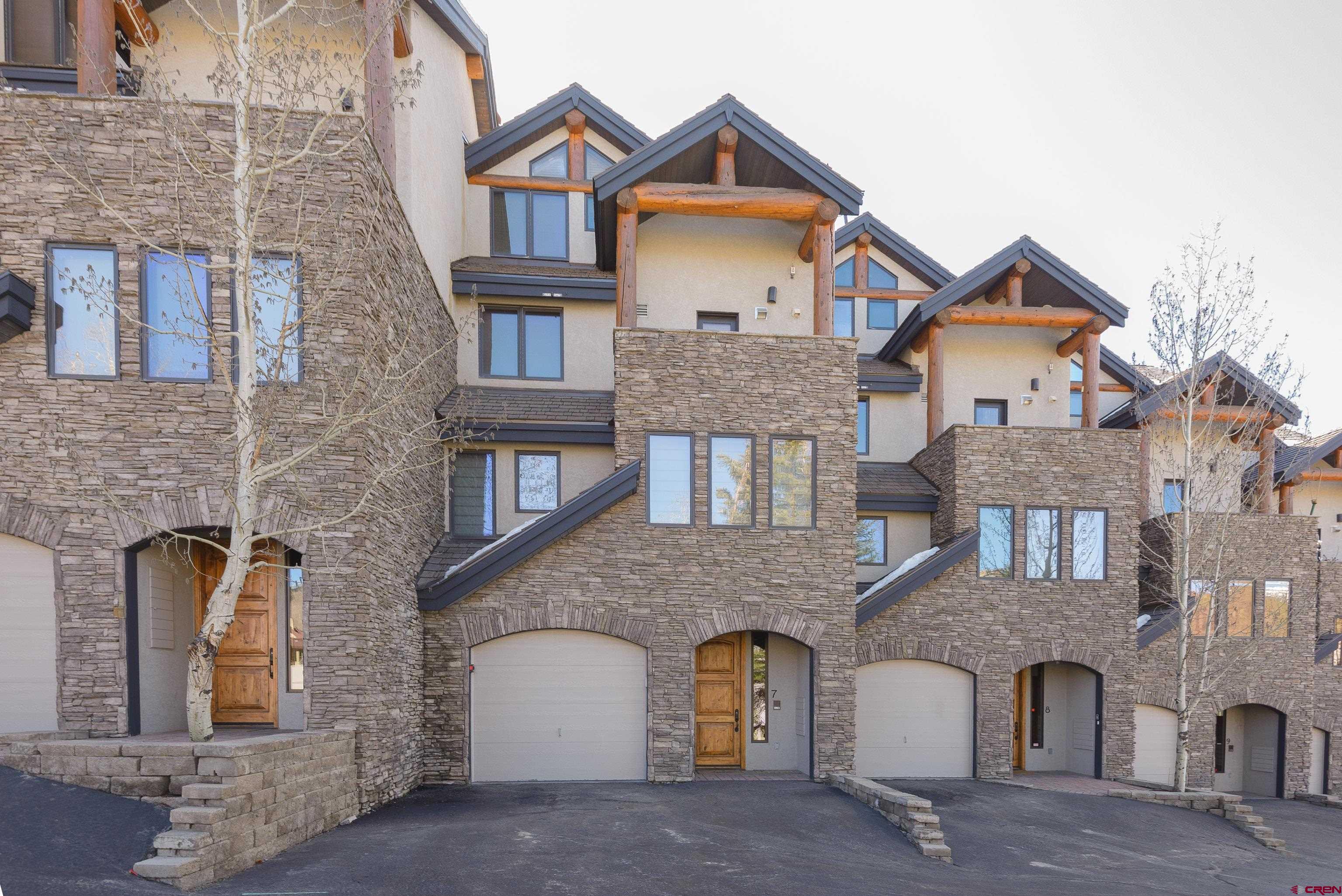 16 Snowmass Road, Unit 7 Crested Butte, CO 81225 - Photo 2 of 37 a front view of a house with balcony