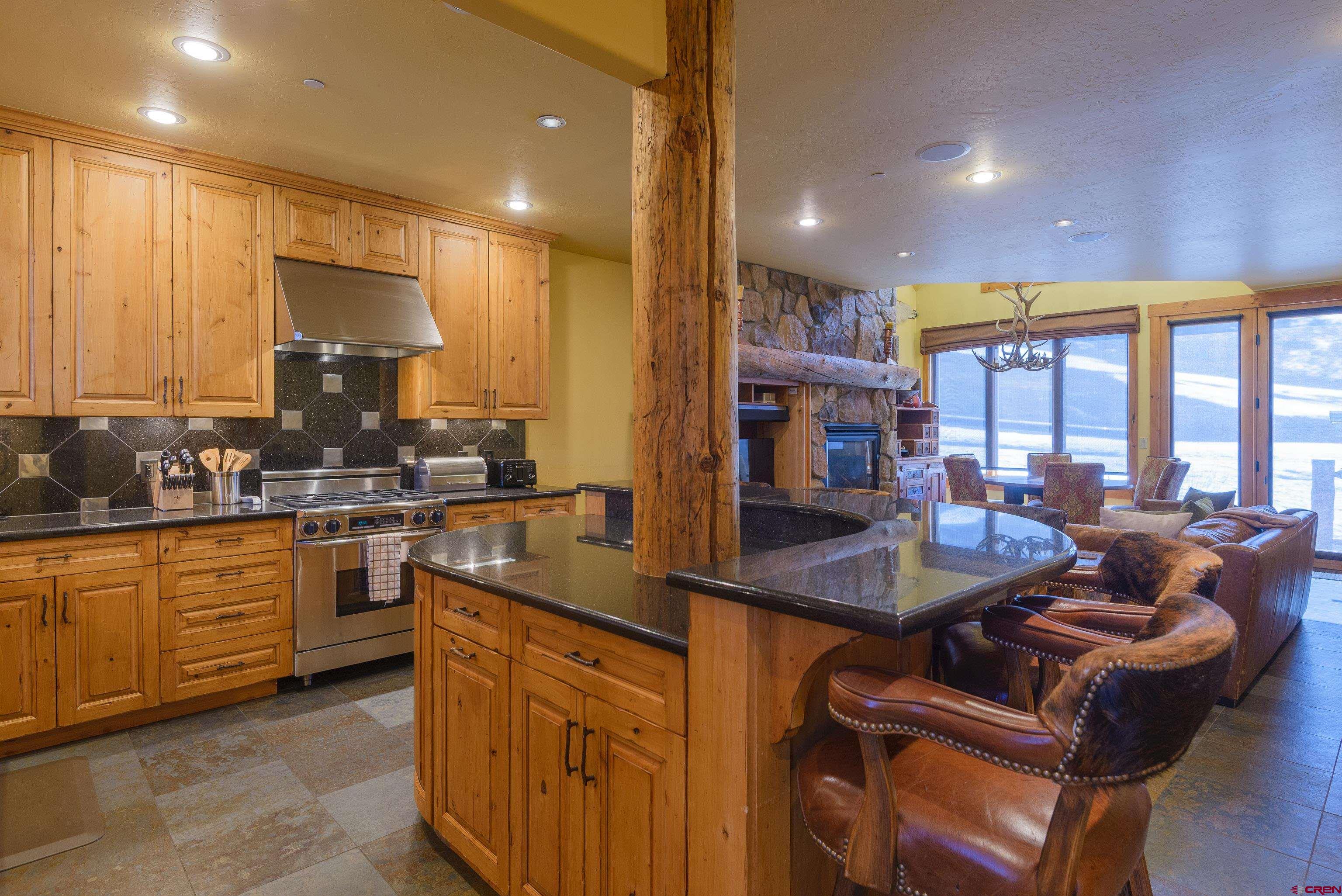16 Snowmass Road, Unit 7 Crested Butte, CO 81225 - Photo 24 of 37 a kitchen with granite countertop lots of counter top space