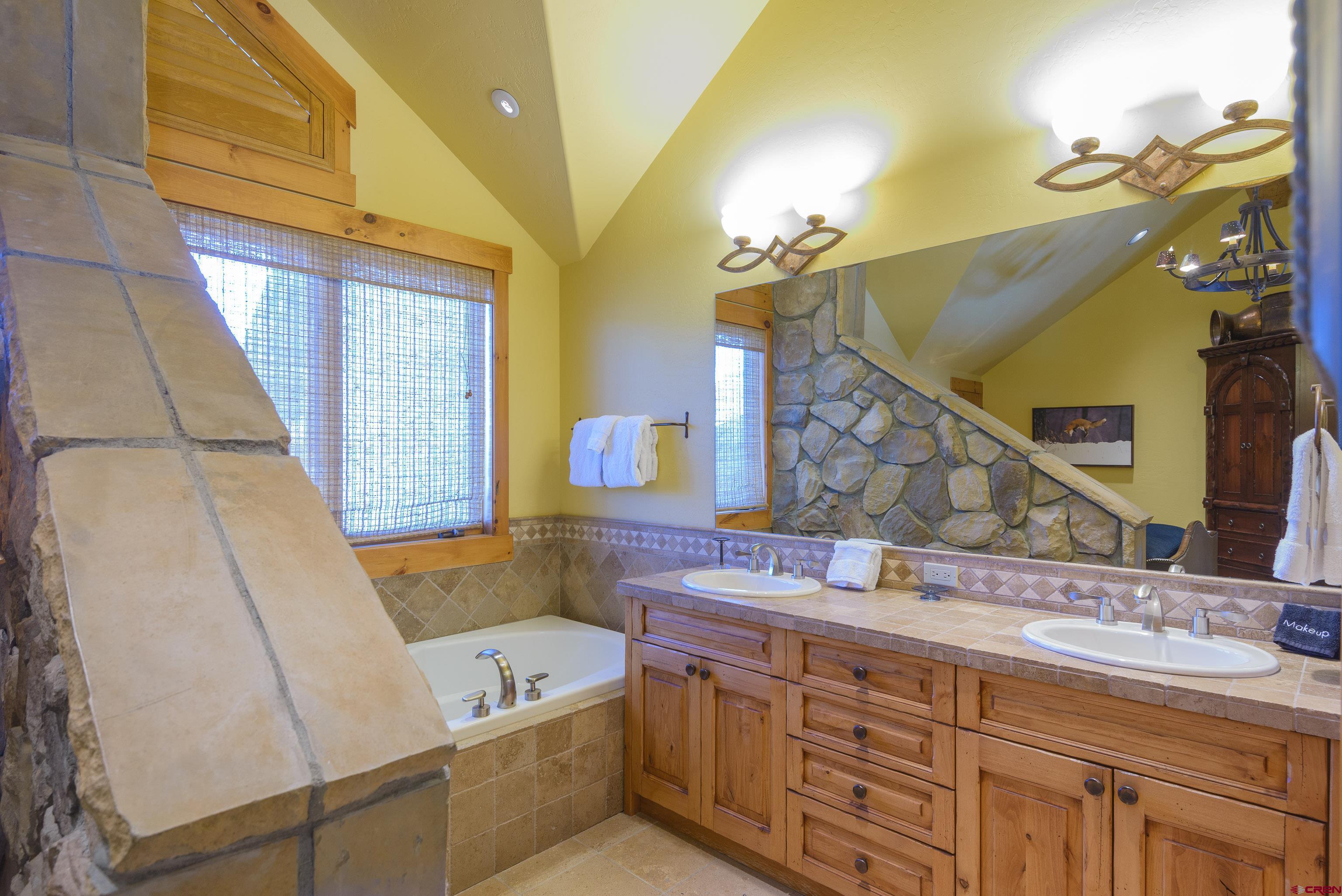 16 Snowmass Road, Unit 7 Crested Butte, CO 81225 - Photo 31 of 37 a bathroom with a sink and a mirror
