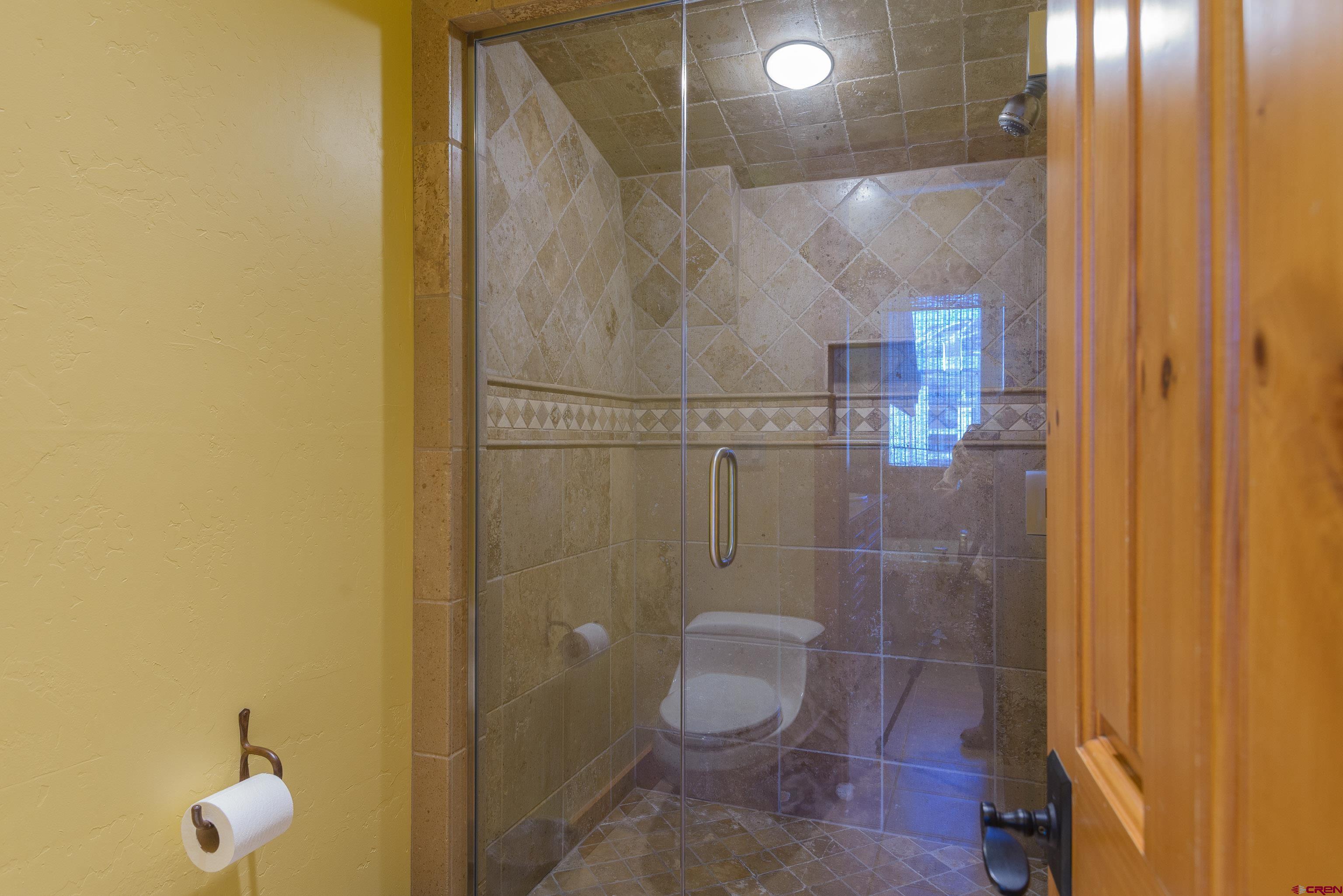 16 Snowmass Road, Unit 7 Crested Butte, CO 81225 - Photo 32 of 37 a bathroom with a toilet and a shower