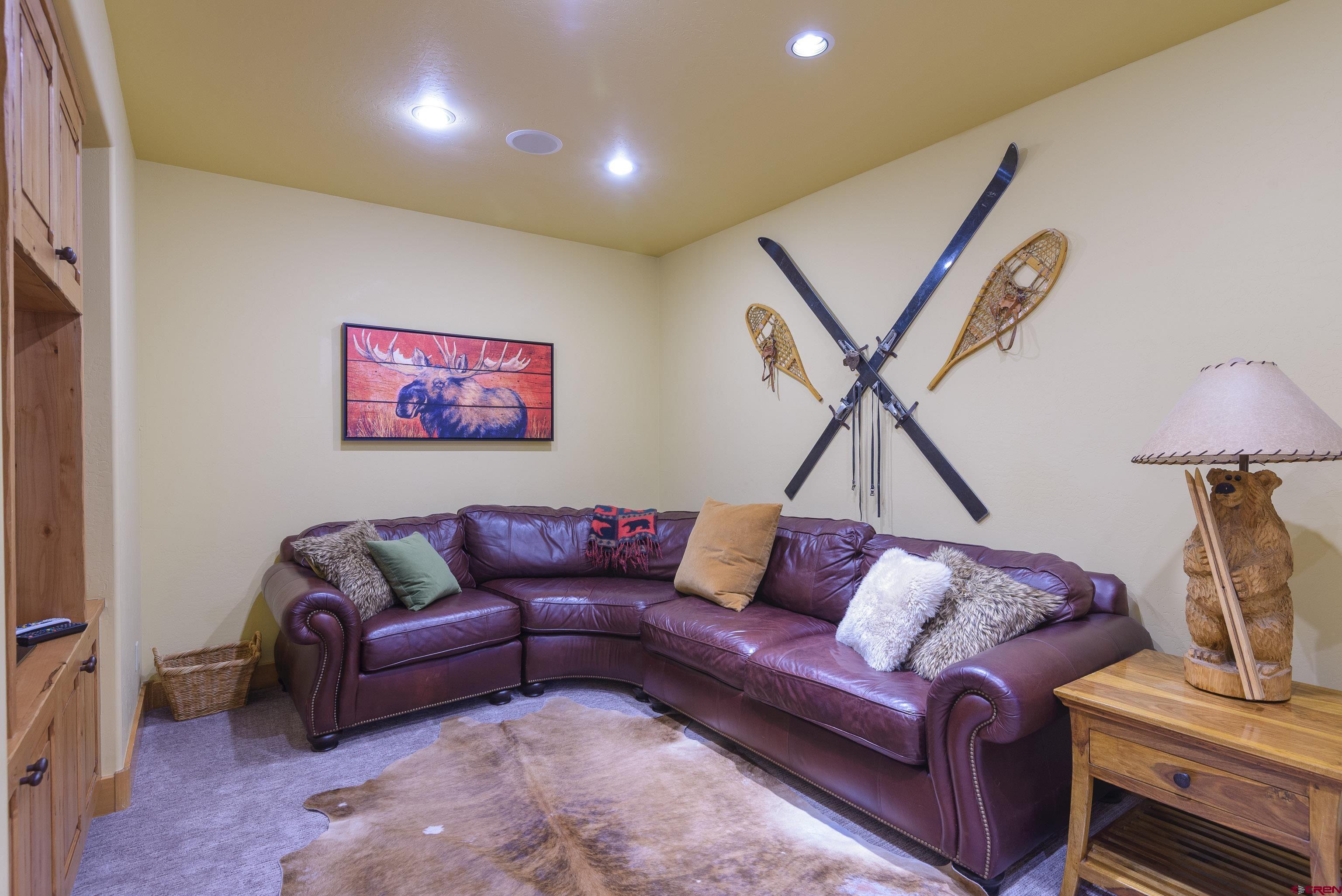 16 Snowmass Road, Unit 7 Crested Butte, CO 81225 - Photo 5 of 37 a living room with furniture and a ceiling fan