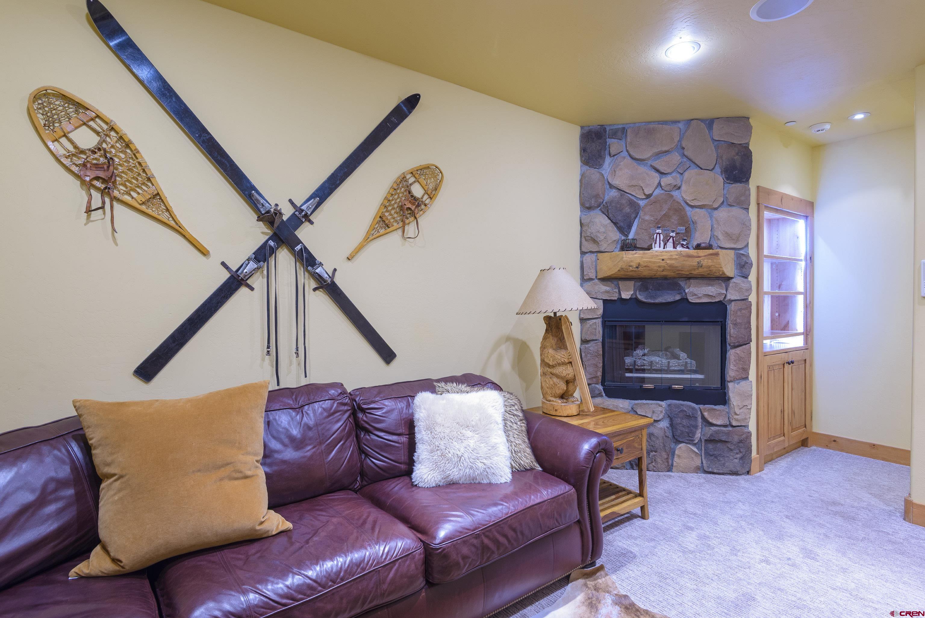 16 Snowmass Road, Unit 7 Crested Butte, CO 81225 - Photo 7 of 37 a living room with furniture and a fireplace