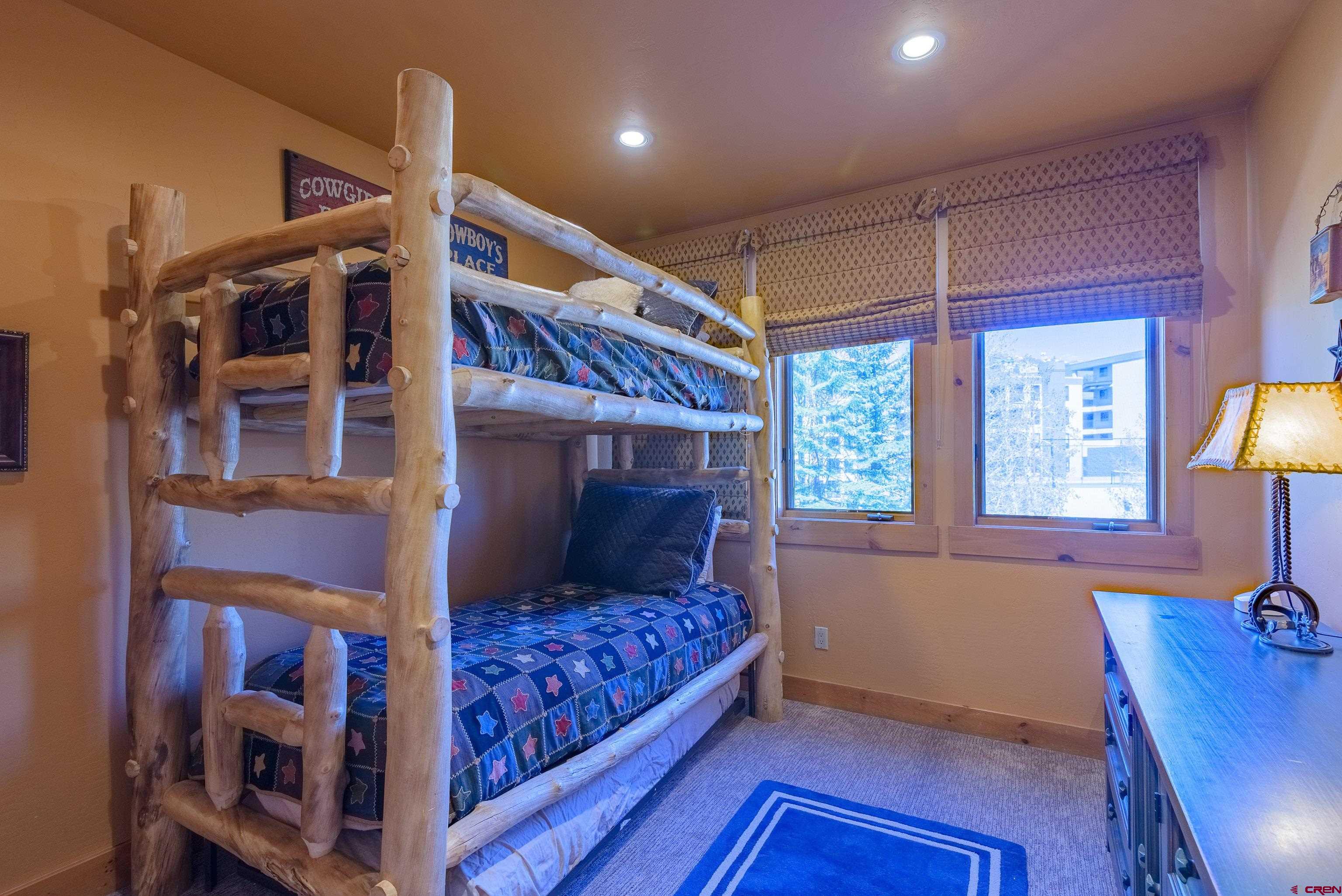 16 Snowmass Road, Unit 7 Crested Butte, CO 81225 - Photo 9 of 37 a bedroom with a bed and a window