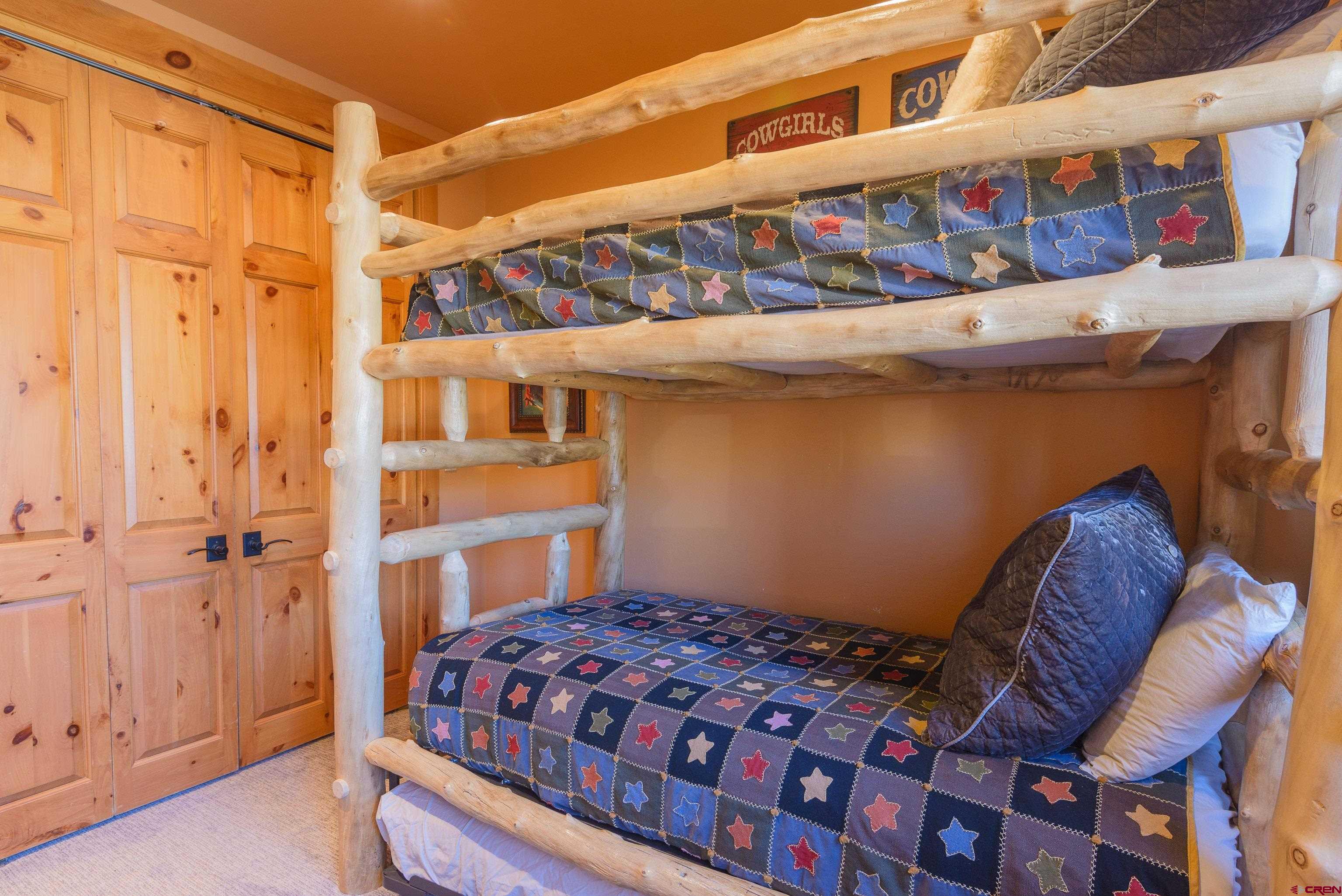 16 Snowmass Road, Unit 7 Crested Butte, CO 81225 - Photo 10 of 37 a bedroom with a bed and a window