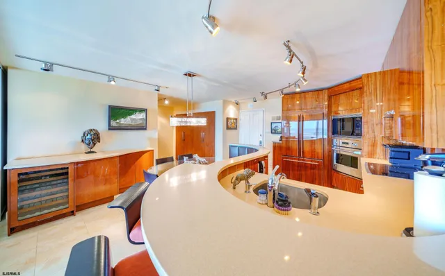 a view of a hallway and a utility room