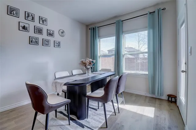 a view of a dining room with furniture and window