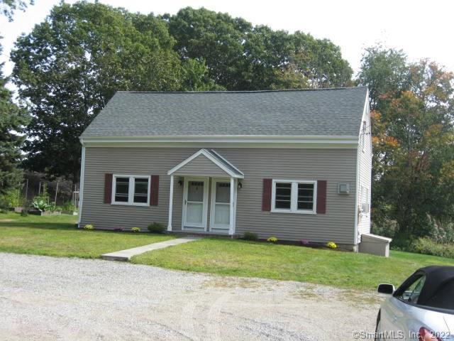 28 Pond Meadow Road Westbrook, CT 06498 - Photo 1 of 1 a front view of a house with a yard