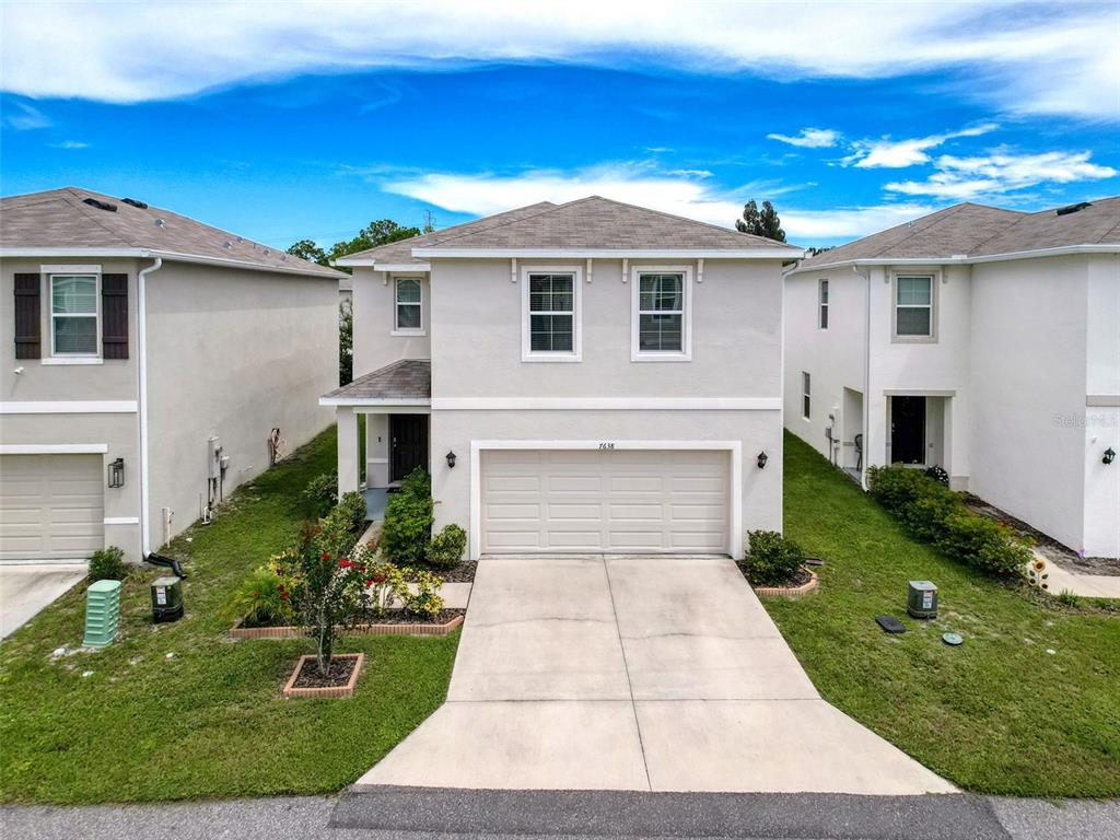 7638 Cypress Walk New Port Richey, FL 34655 - Photo 1 of 1 a front view of a house with a yard
