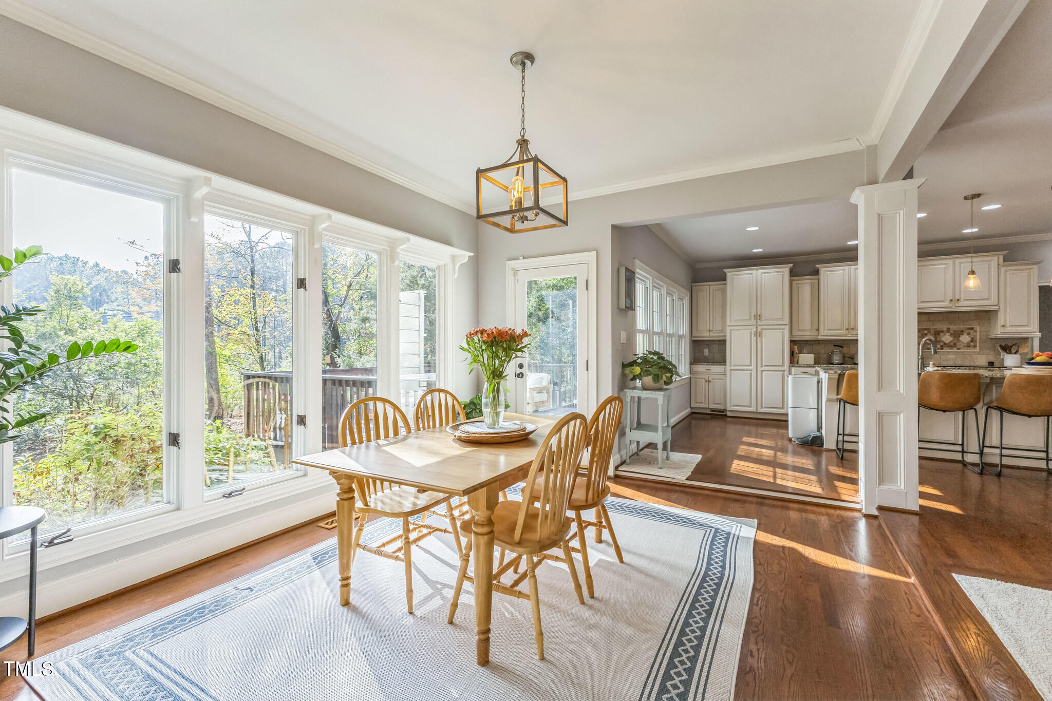 1708 Pendelton Drive Raleigh, NC 27614 - Photo 13 of 54 a view of a dining room with furniture window and wooden floor