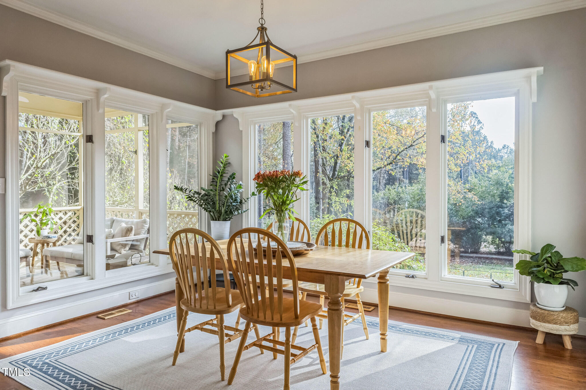 1708 Pendelton Drive Raleigh, NC 27614 - Photo 14 of 54 a view of a dining room with furniture window and wooden floor