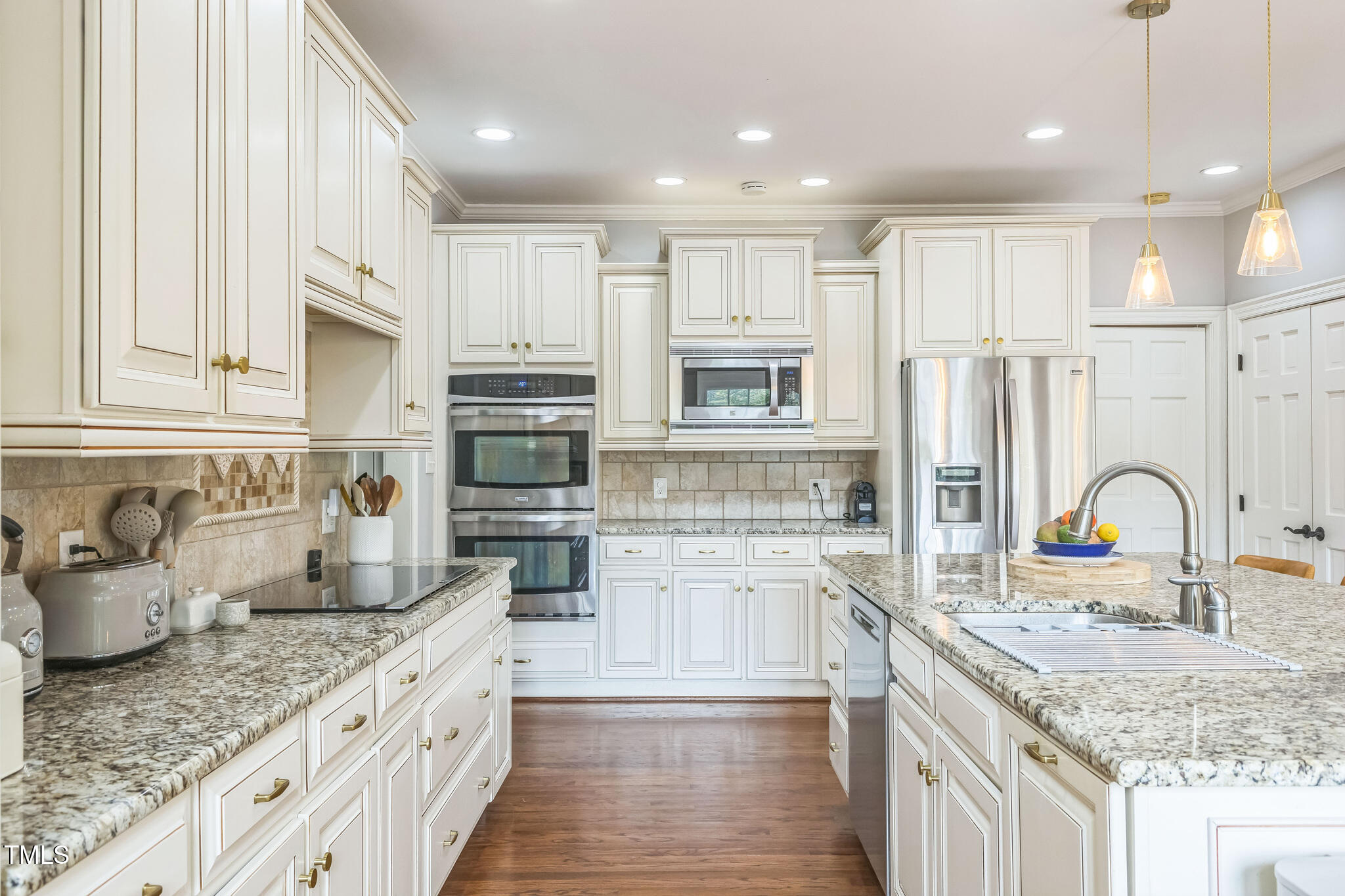 1708 Pendelton Drive Raleigh, NC 27614 - Photo 17 of 54 a kitchen with stainless steel appliances granite countertop a sink and cabinets