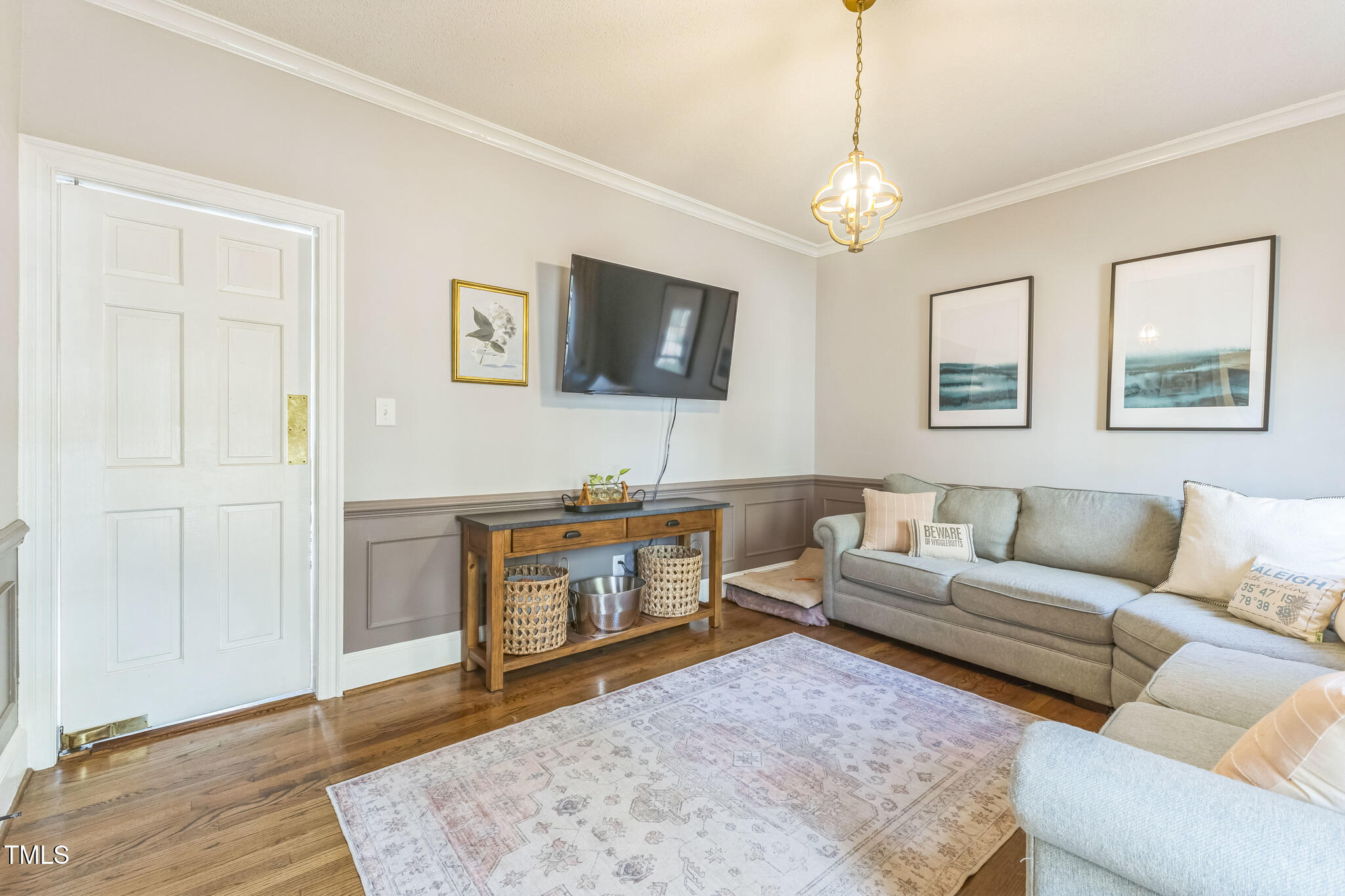 1708 Pendelton Drive Raleigh, NC 27614 - Photo 18 of 54 a living room with furniture a flat screen tv and a rug