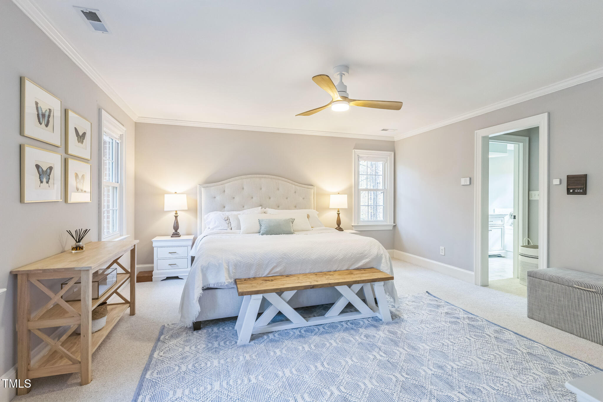 1708 Pendelton Drive Raleigh, NC 27614 - Photo 20 of 54 a bedroom with a bed and a chandelier