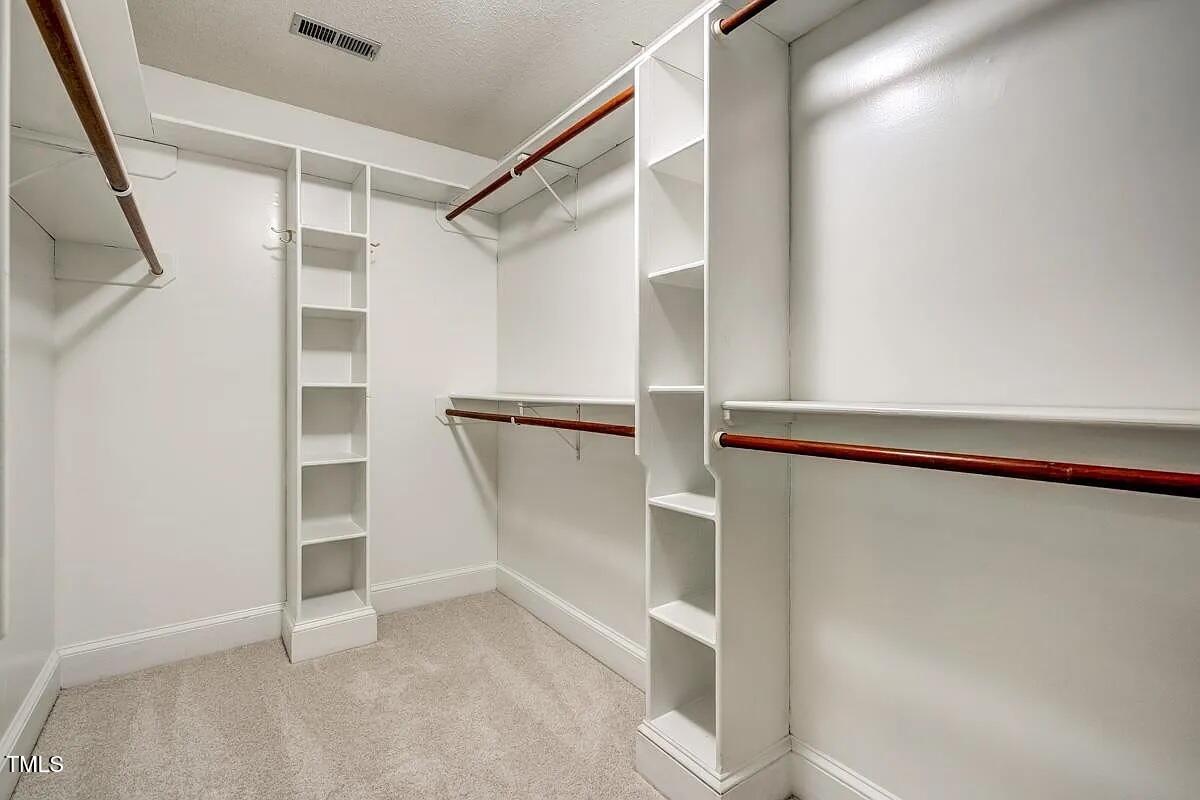 1708 Pendelton Drive Raleigh, NC 27614 - Photo 24 of 54 a view of walk in closet with empty racks