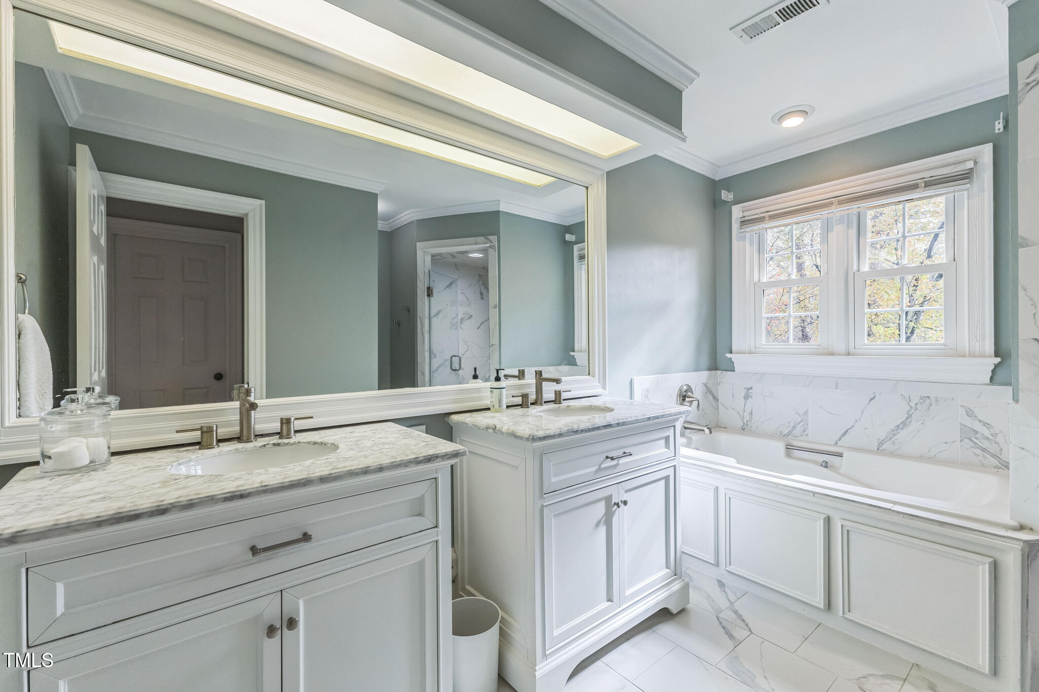 1708 Pendelton Drive Raleigh, NC 27614 - Photo 25 of 54 a bathroom with a sink and a window
