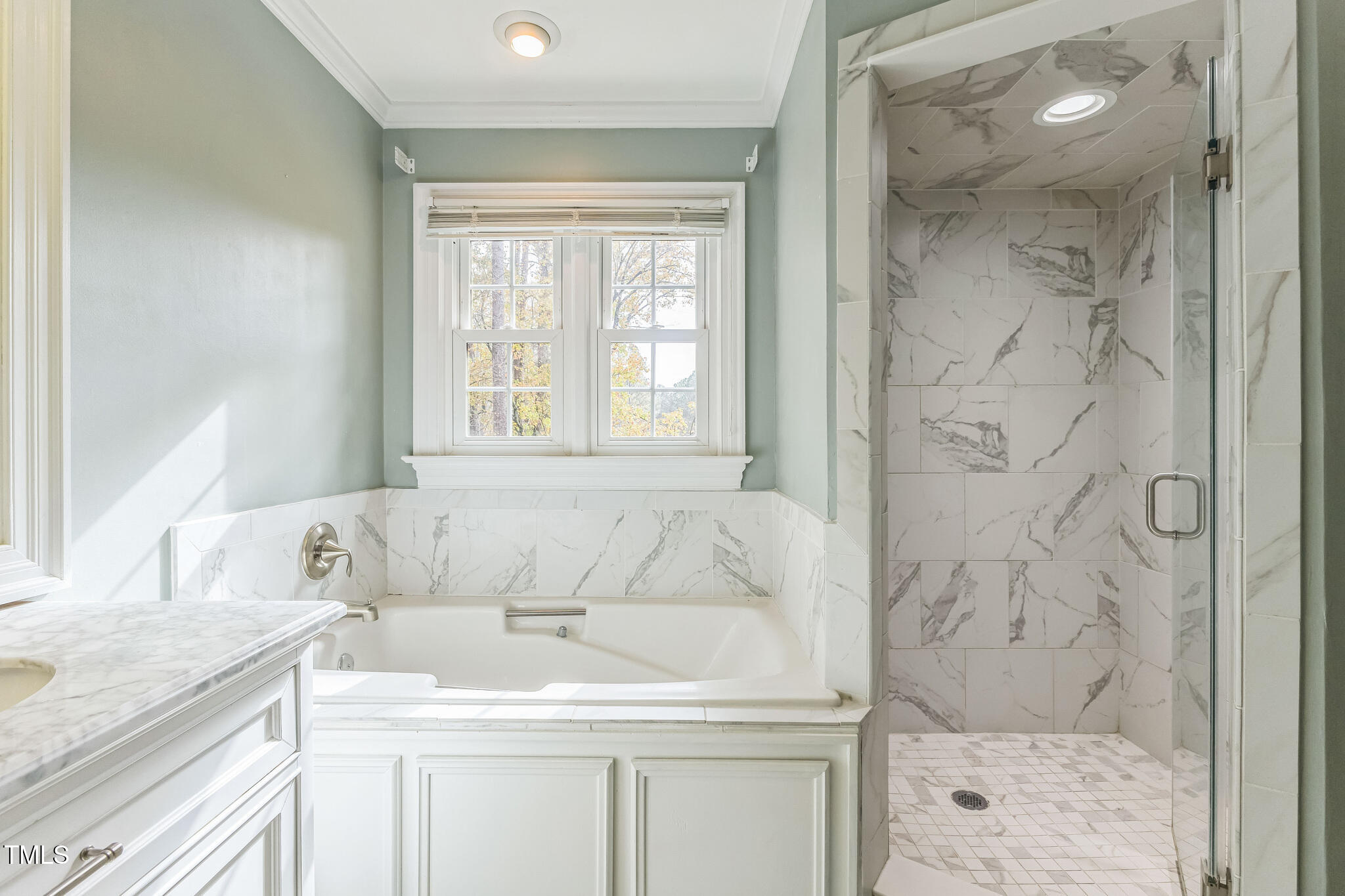 1708 Pendelton Drive Raleigh, NC 27614 - Photo 26 of 54 a bathroom with a granite countertop sink a bathtub and shower