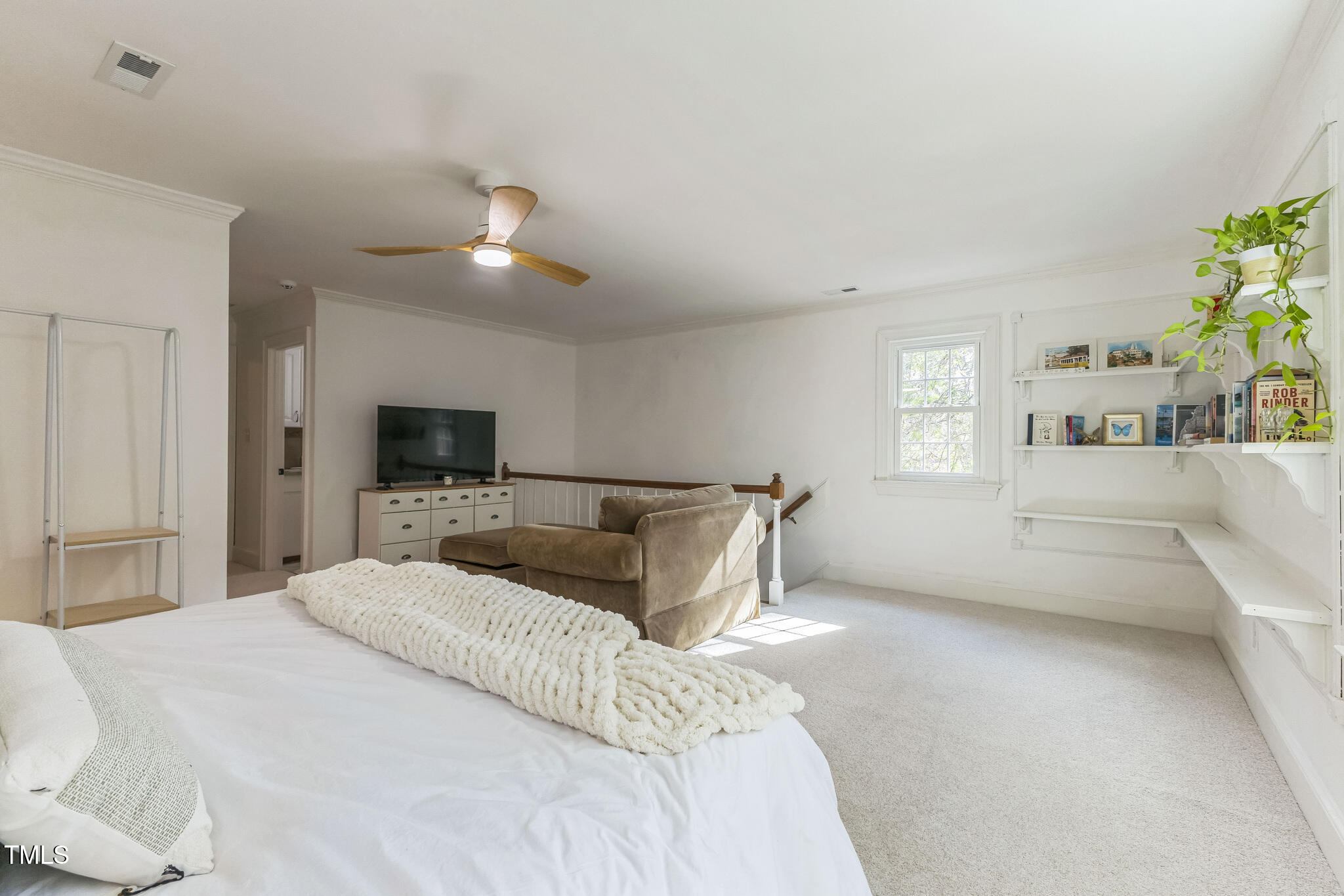 1708 Pendelton Drive Raleigh, NC 27614 - Photo 27 of 54 a bedroom with a large bed and a tv
