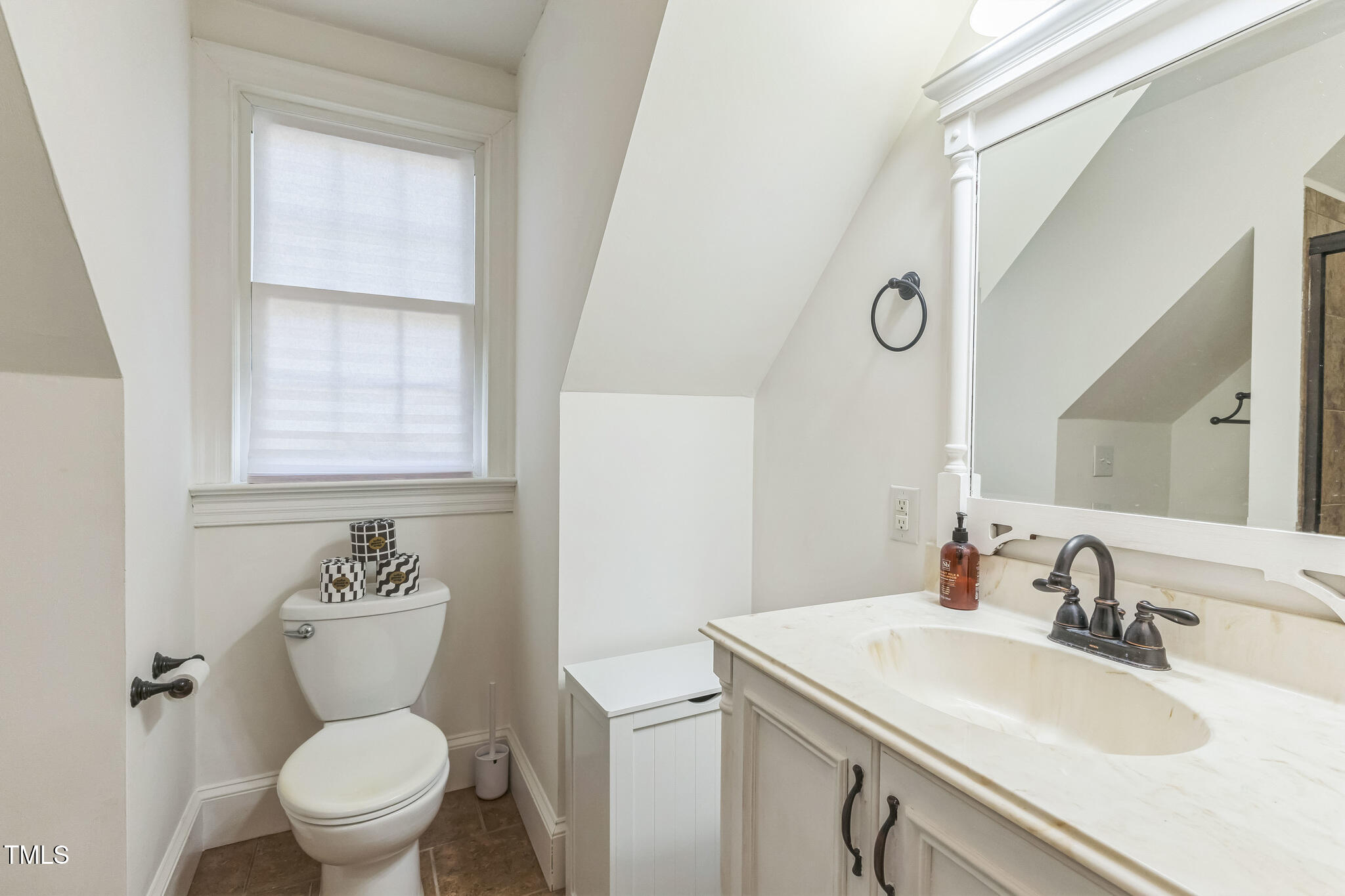 1708 Pendelton Drive Raleigh, NC 27614 - Photo 33 of 54 a bathroom with a toilet sink and mirror